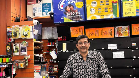 Jay Modi, owner of Willow Smokes and Cigars stands behind the counter