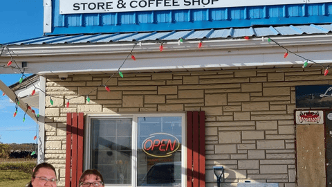 Owners of The Wooden Shoe standing outside their store.