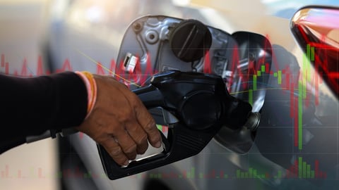 hand on pump, statistics of rising prices in background