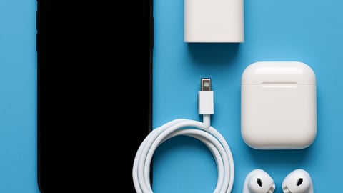 mobile phone with cable, ear buds, charger and plug