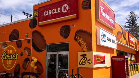 Exterior shot of Circle K wrapped in Reese's promotional imagery