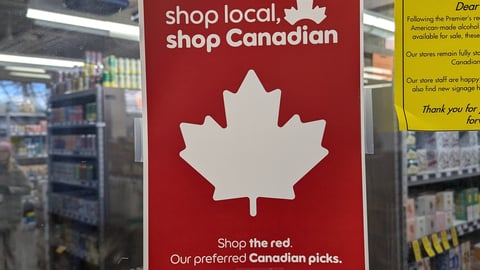 Buy Canadian sign in Banff liquor store