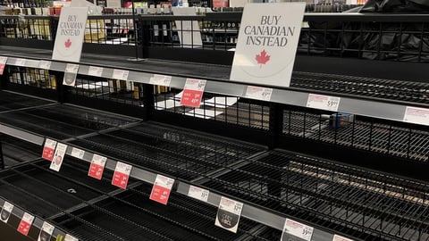 empty shelves in liquor store and buy Canadian sign