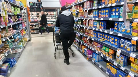 Man pushing a grocery cart