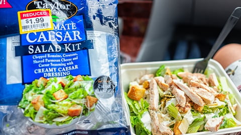 Taylor farms salad kit and a takeout salad