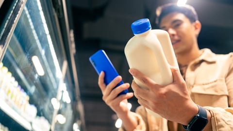 smartphone-scanning shopper