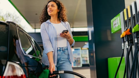 woman at gas pump