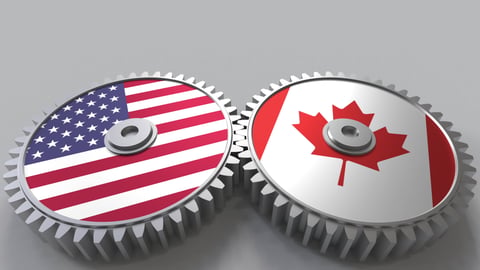 mechanical cogs with American and Canadian flag