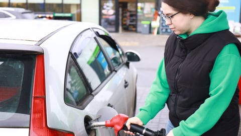 woman pumping gas