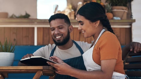 Stock Image of two store owners making plans
