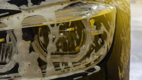 Car with soap in car wash