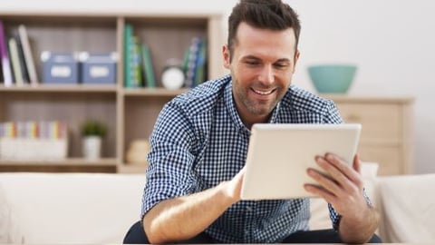 Stock image of a man shopping with a tablet teaser