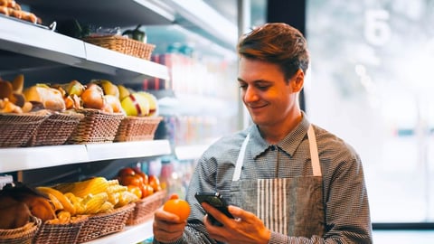 Store Staff working next to food shelves