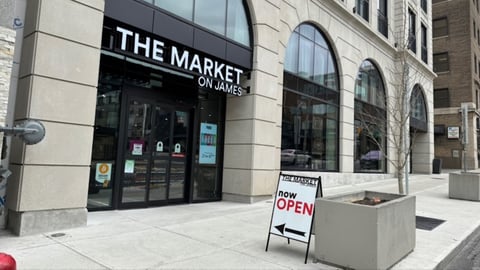 The Market on James open sign