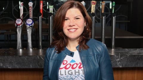 Chantalle Butler in front of brew taps