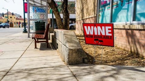 Store with a sign to sell wine teaser