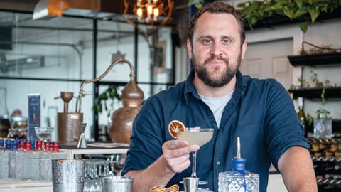 Graham Reid holding a G&T