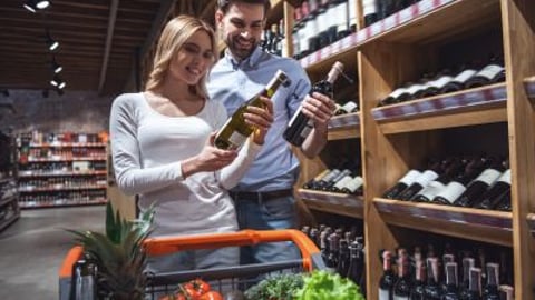 Couple buying food and wine teaser