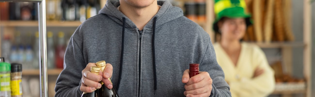 young man buying bottles of wine