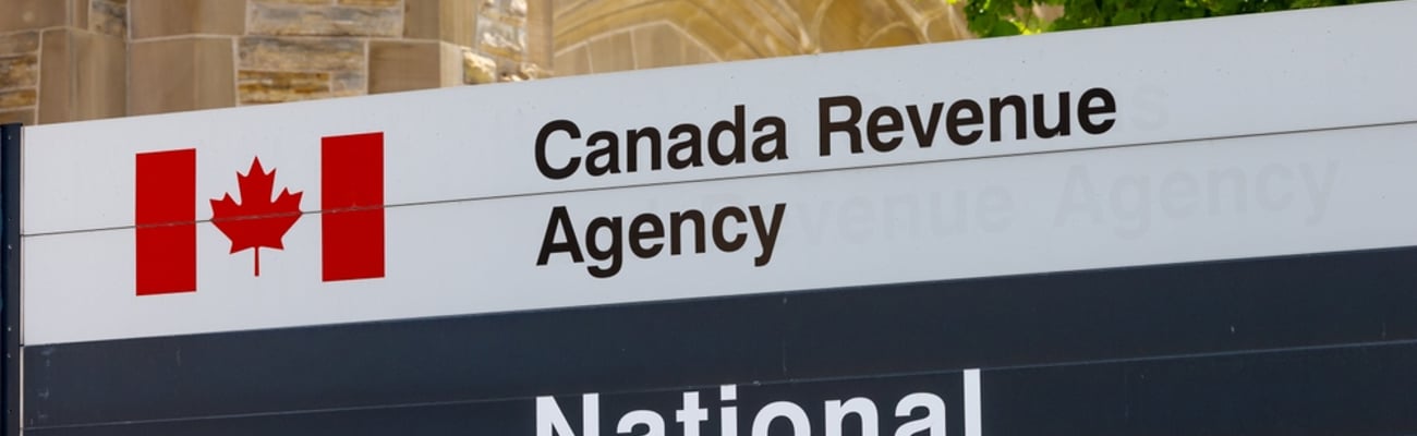 Sign for the Canada Revenue Agency National Headquarters in front of the CRA building.