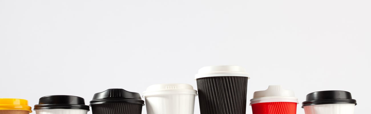 row of take-out coffee cups
