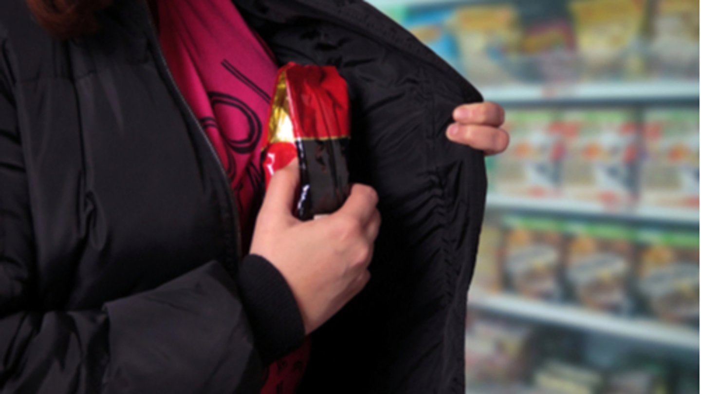 Woman shoplifting in a store