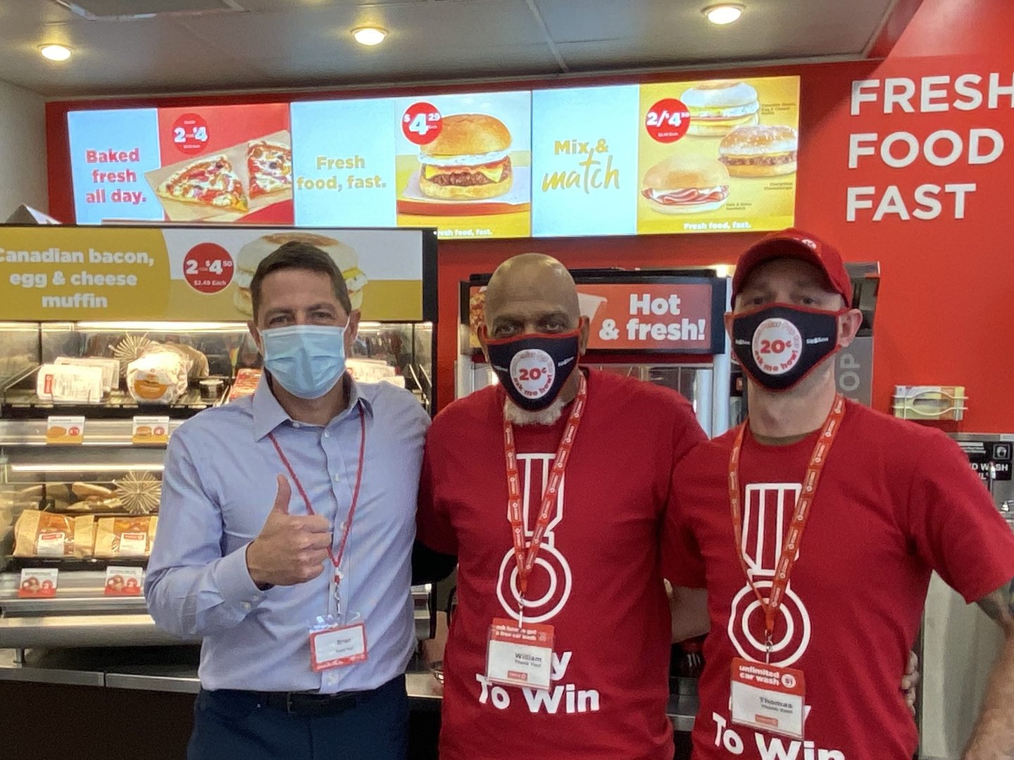 Brian Hannasch in a store on site with team mates