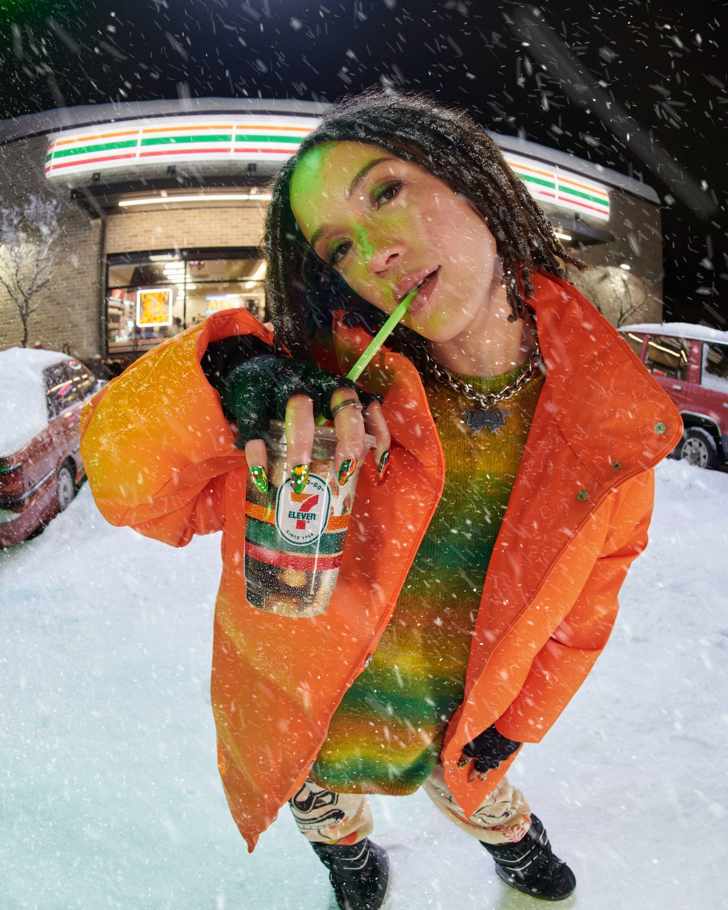 A woman drinking an ice coffee in a storm