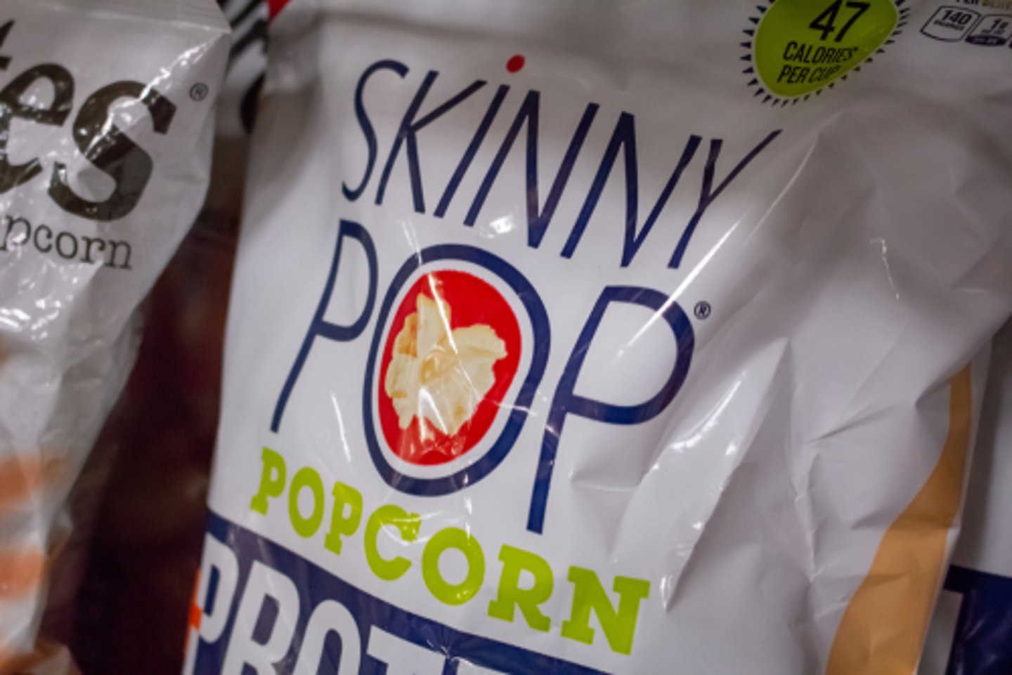 Bag of Skinnypop popcorn on a shelf