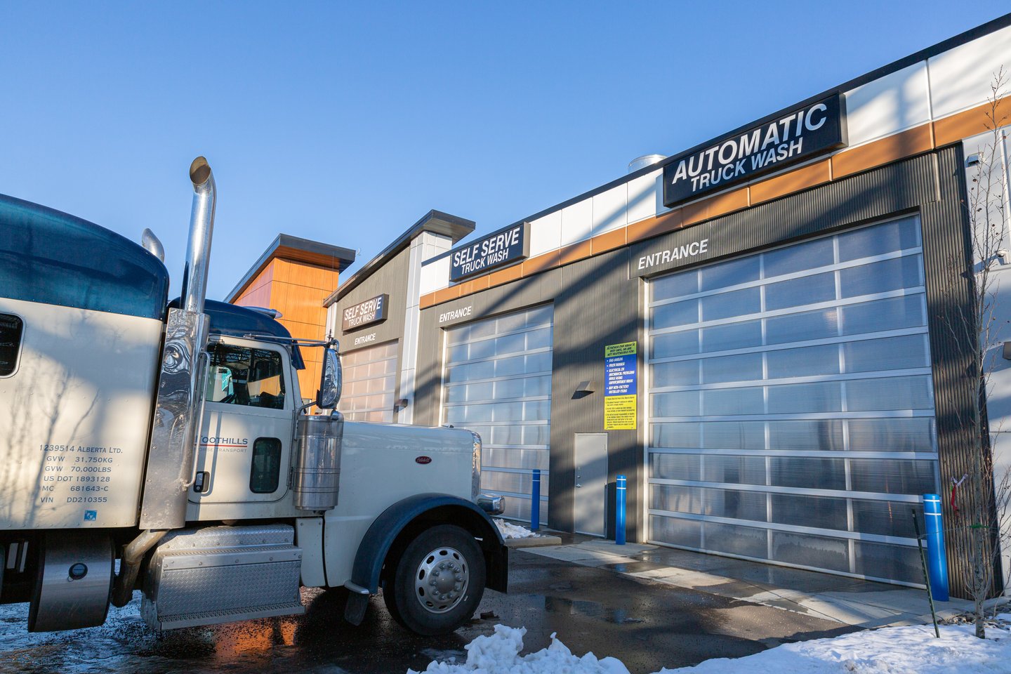 Trucks waiting before a car wash in winter