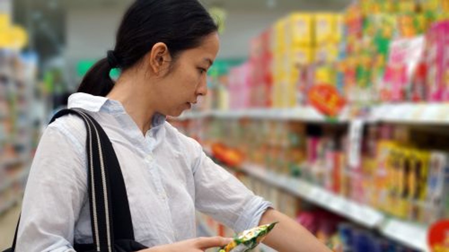 Female Asian Grocery Shopper Stock Image