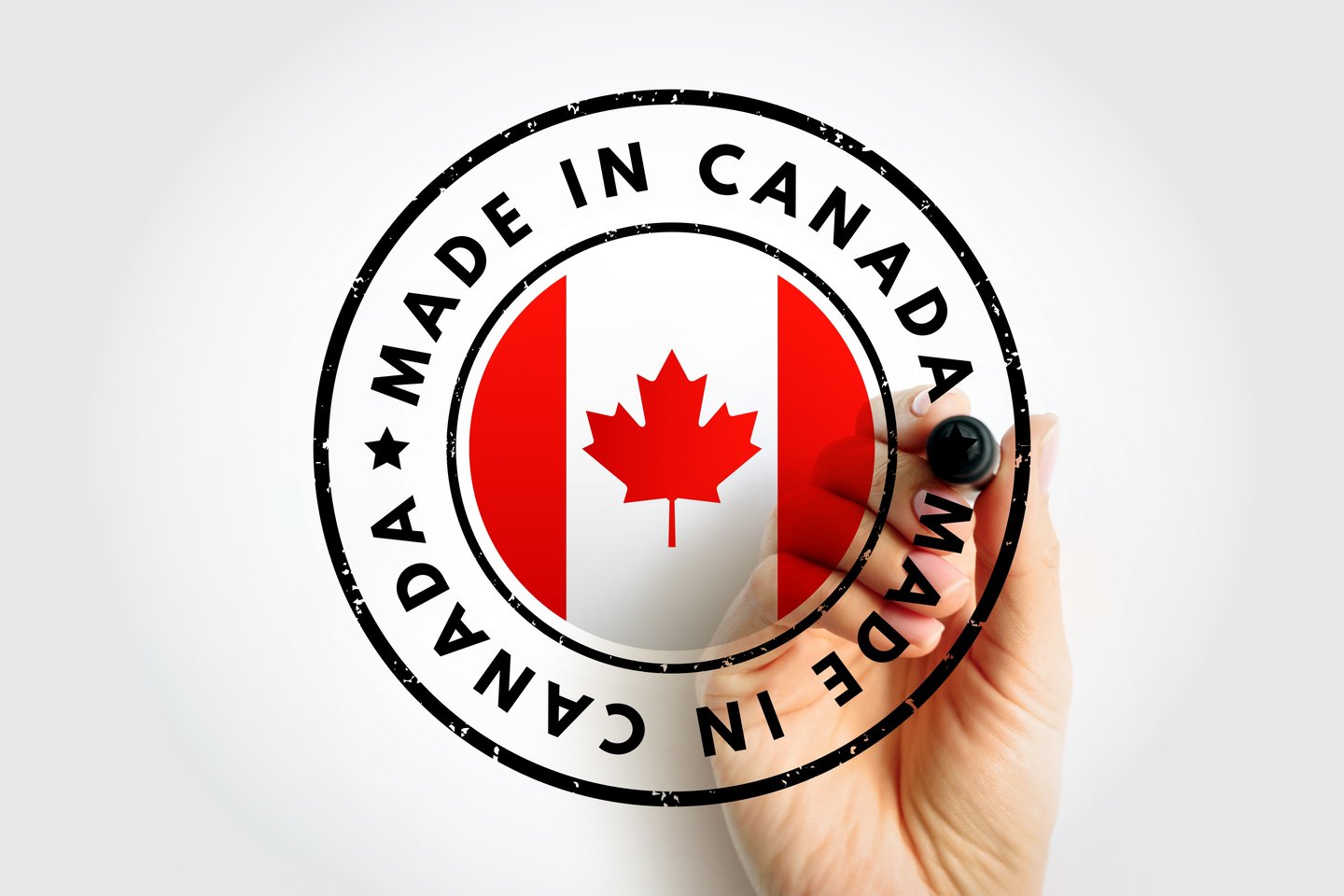 A hand writing Made in Canada