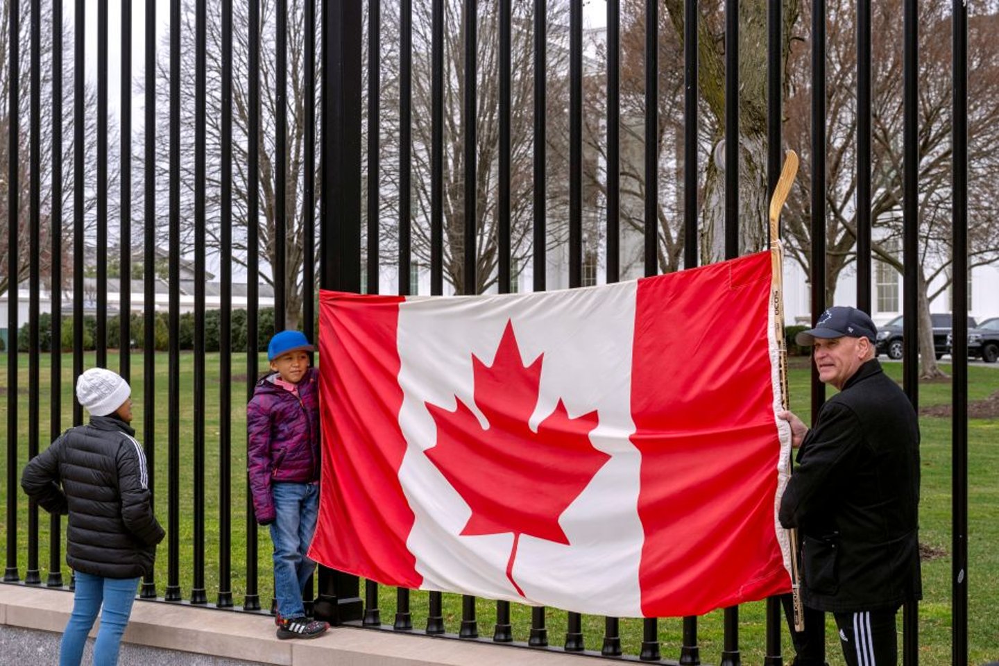 Canadian flag at tariff protest US CP