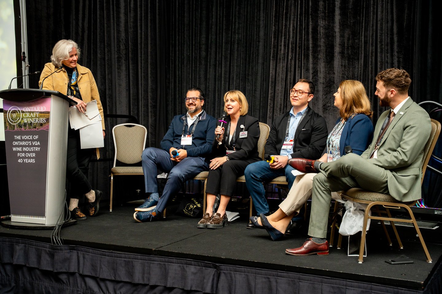 Carolyn Hurst, president and co-founder, Westcott Vineyard, moderated.   Seated from left: Giancarlo Trimarchi, president, Vince's Market; Jennifer Gordon, assistant general merchandise manager, cooler, liquor, sundries, tobacco, Costco Wholesale;  Lucas Babando, category manager, beer, RTDs, cider and wine, Circle K; Anne Kothawala, president and CEO, CICC; and Sebastian Prins, director of government relations (Ontario), Retail Council of Canada 