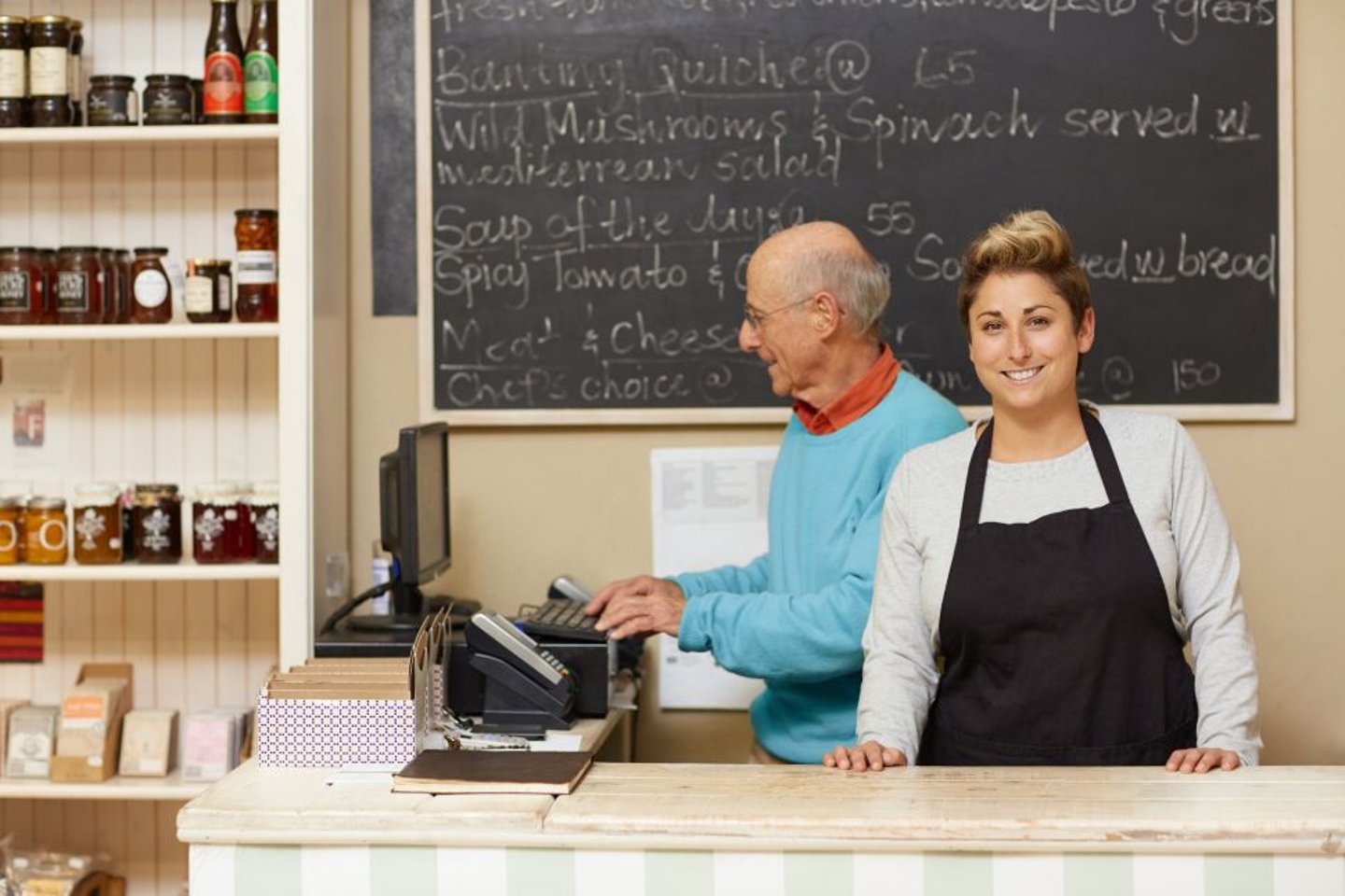 Father and Daughter operating a business stock image