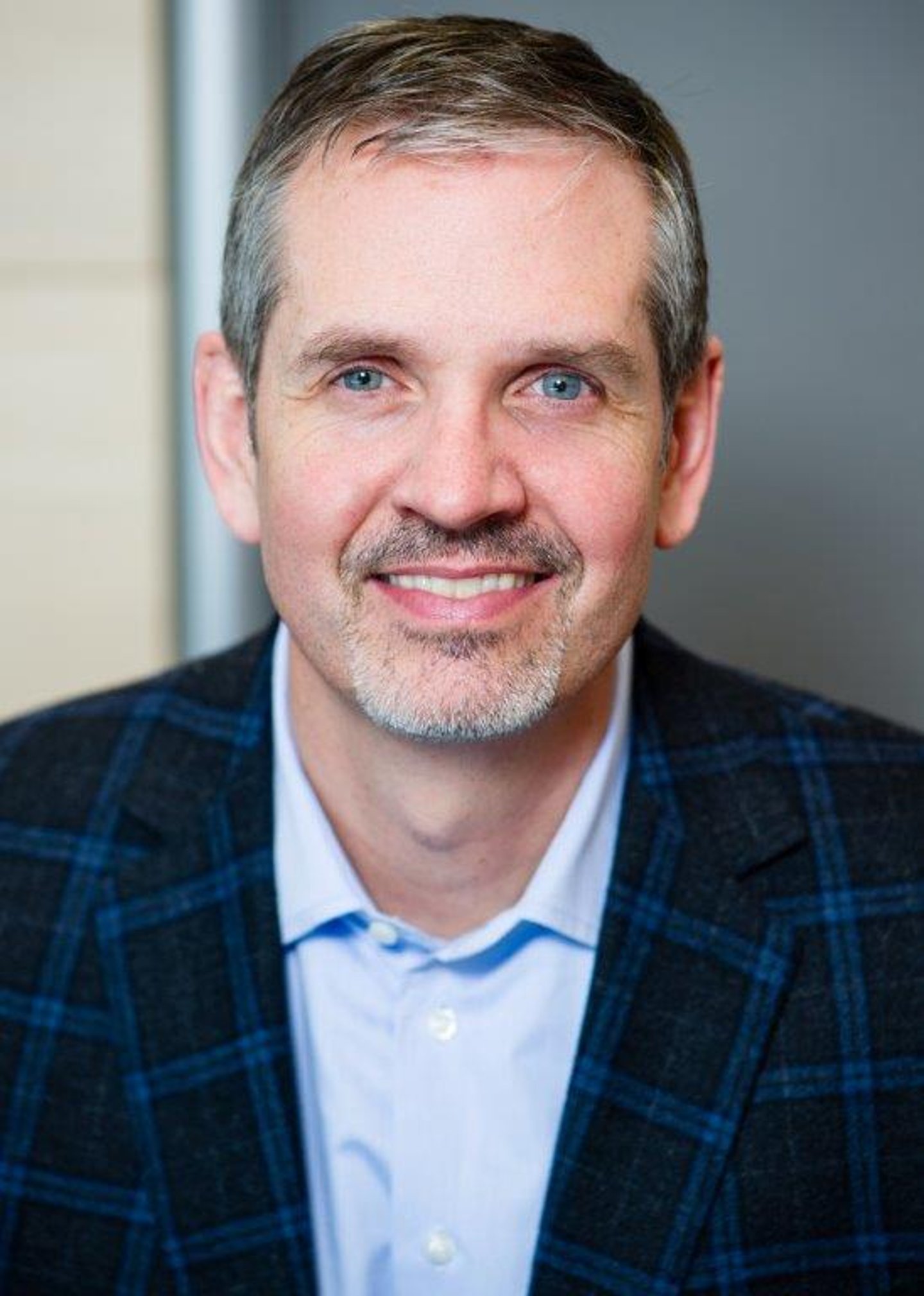 headshot of Pete Vanslyke in a blue shirt and jacket