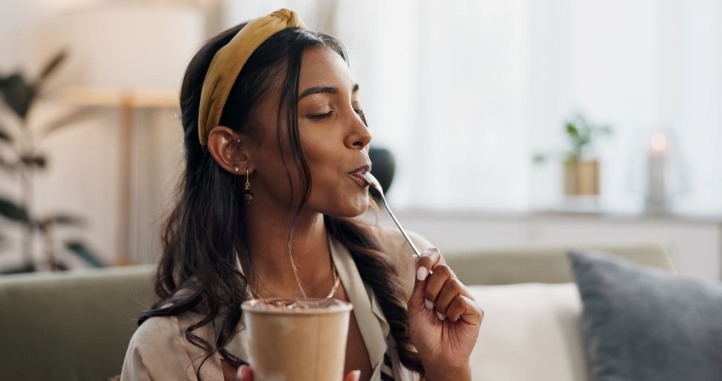 Woman Enjoying a Frozen Treat Stock Image