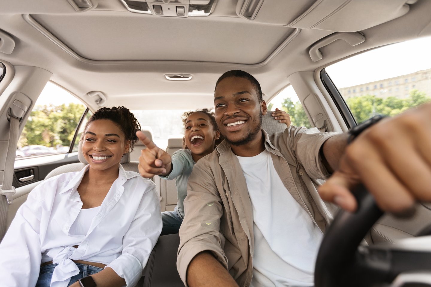 Excited  Family Driving New Auto