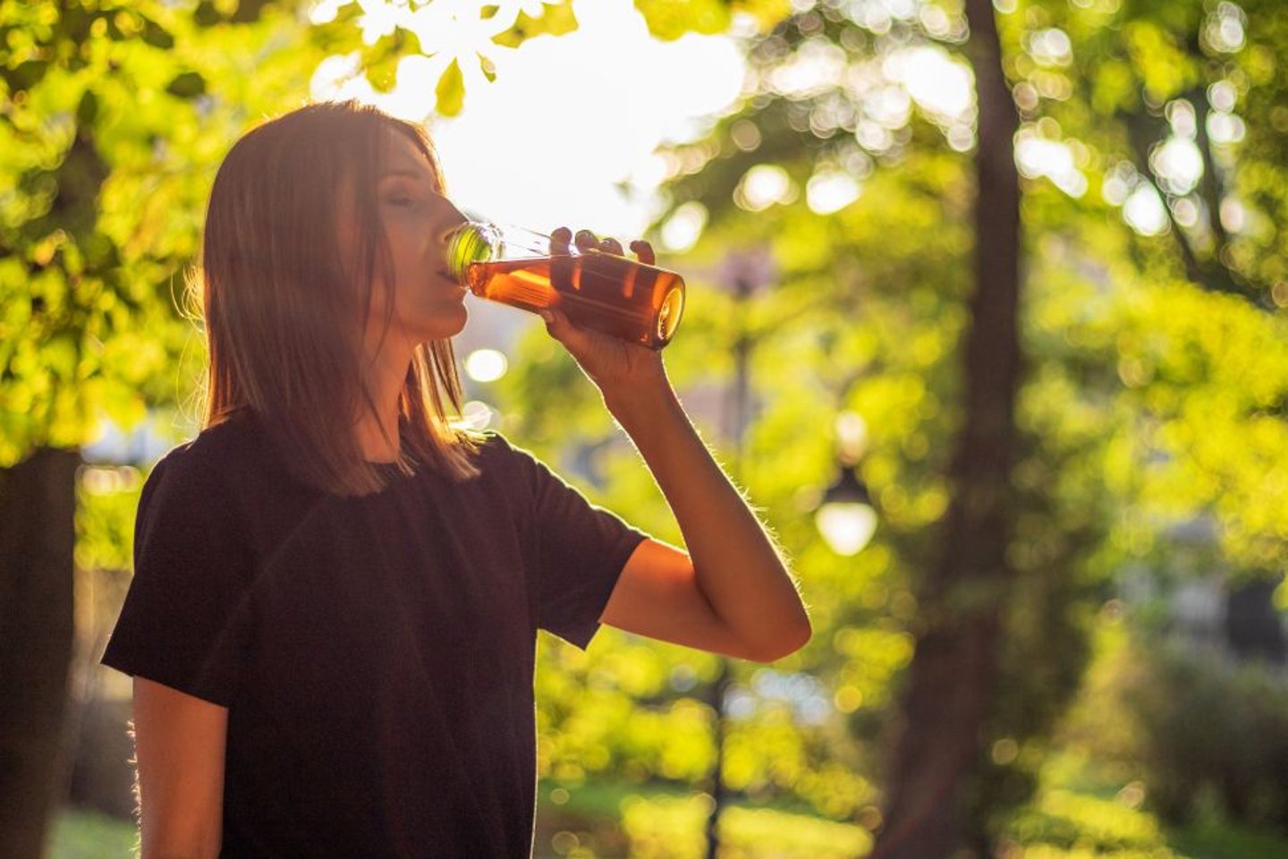 Woman drinking iced tea