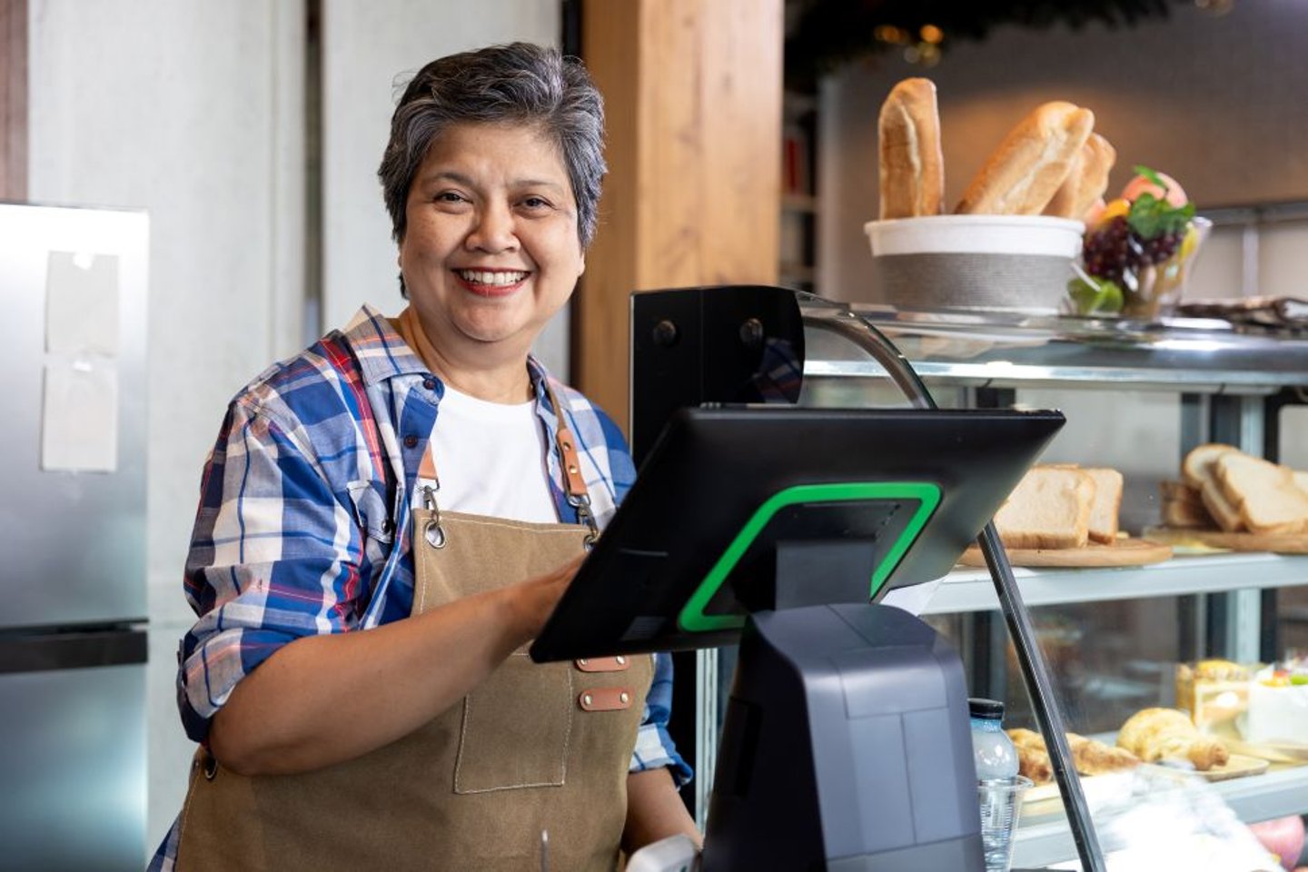Older Store Owner Behind Counter Stock Image