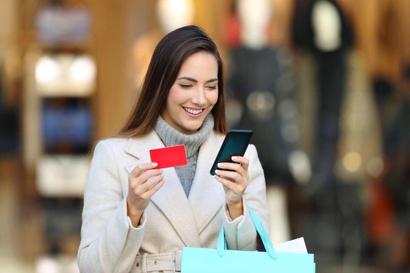 Woman shopping with a gift card stock image