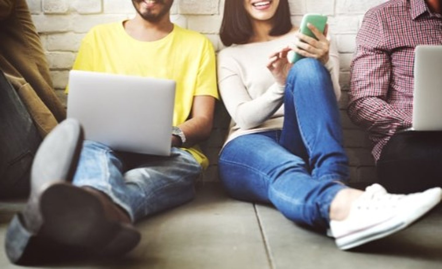 Students on laptops and cell phones