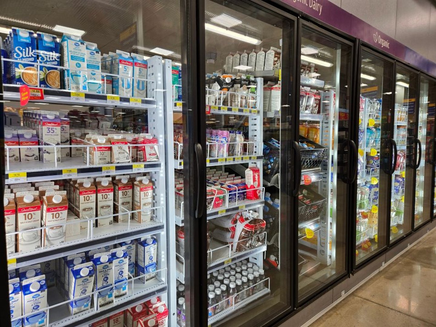 Milk cartons in a store freezer stock image