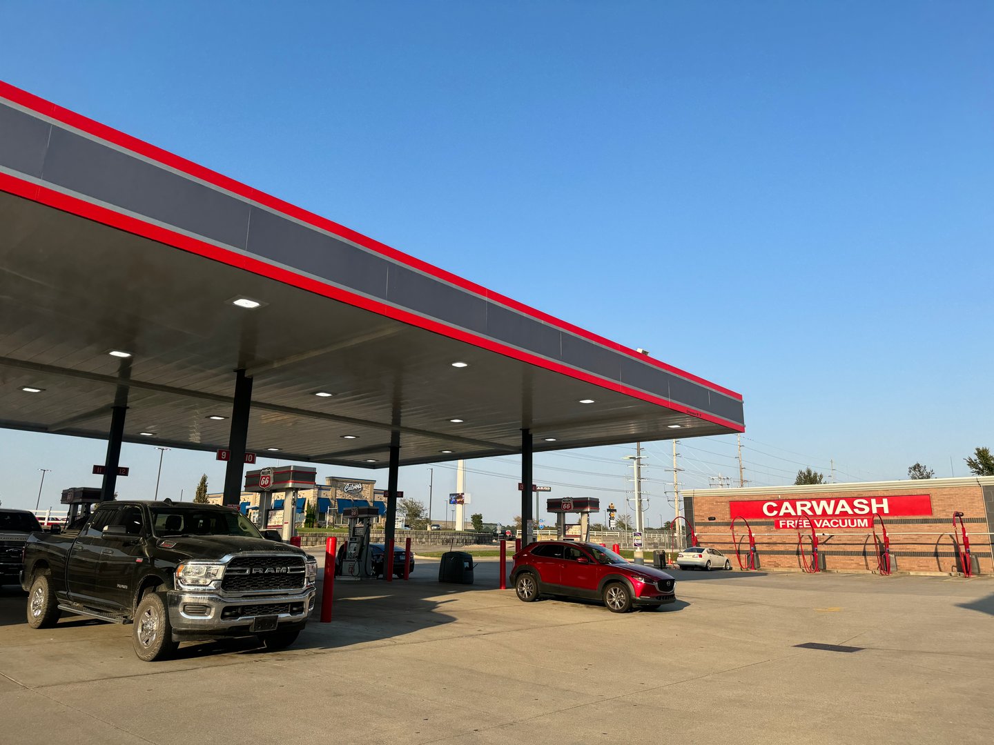 gas station with car wash in the background