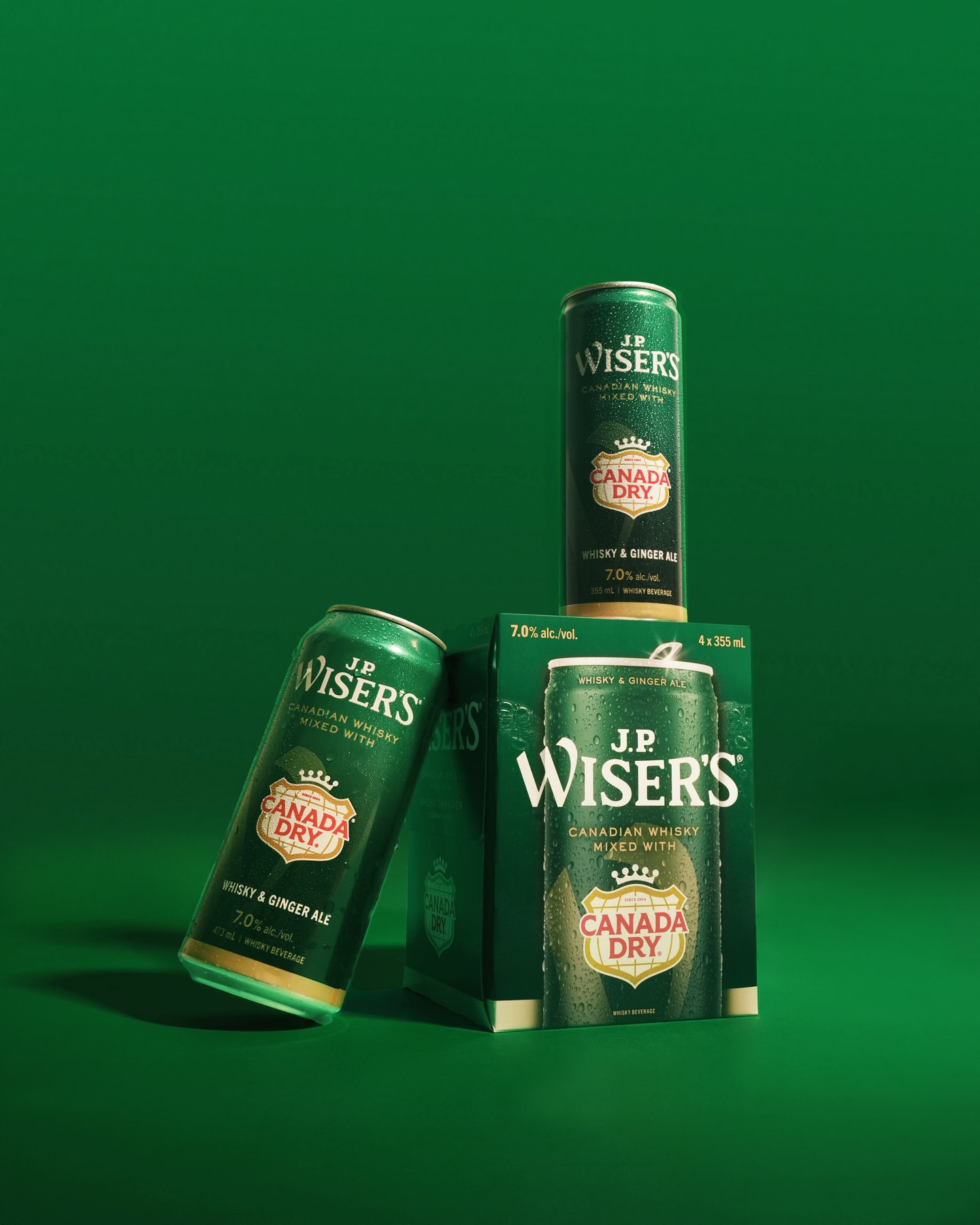 image of product, can leaning on product box and one on top, everything very green like Canada Dry.