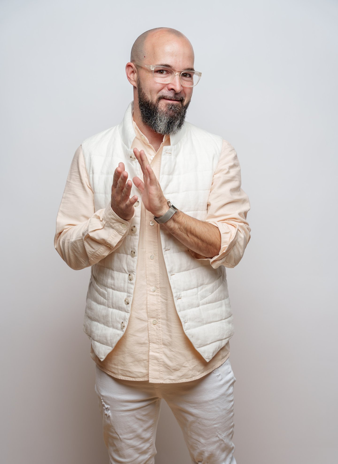 full length shot of Sean Claessen, wearing white/beige