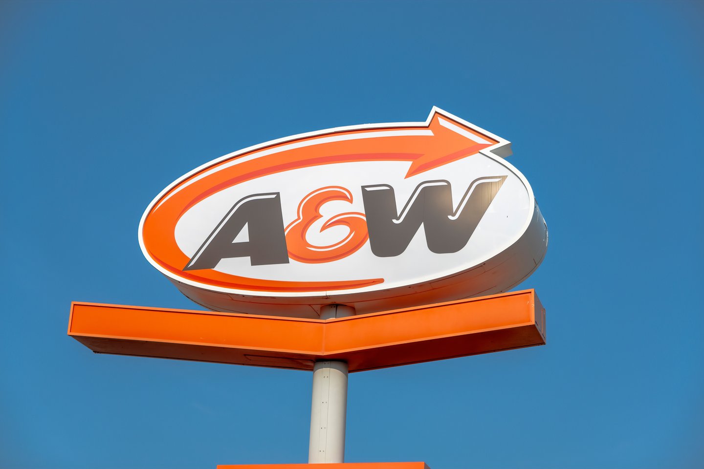 A&W sign outdoors against blue sky