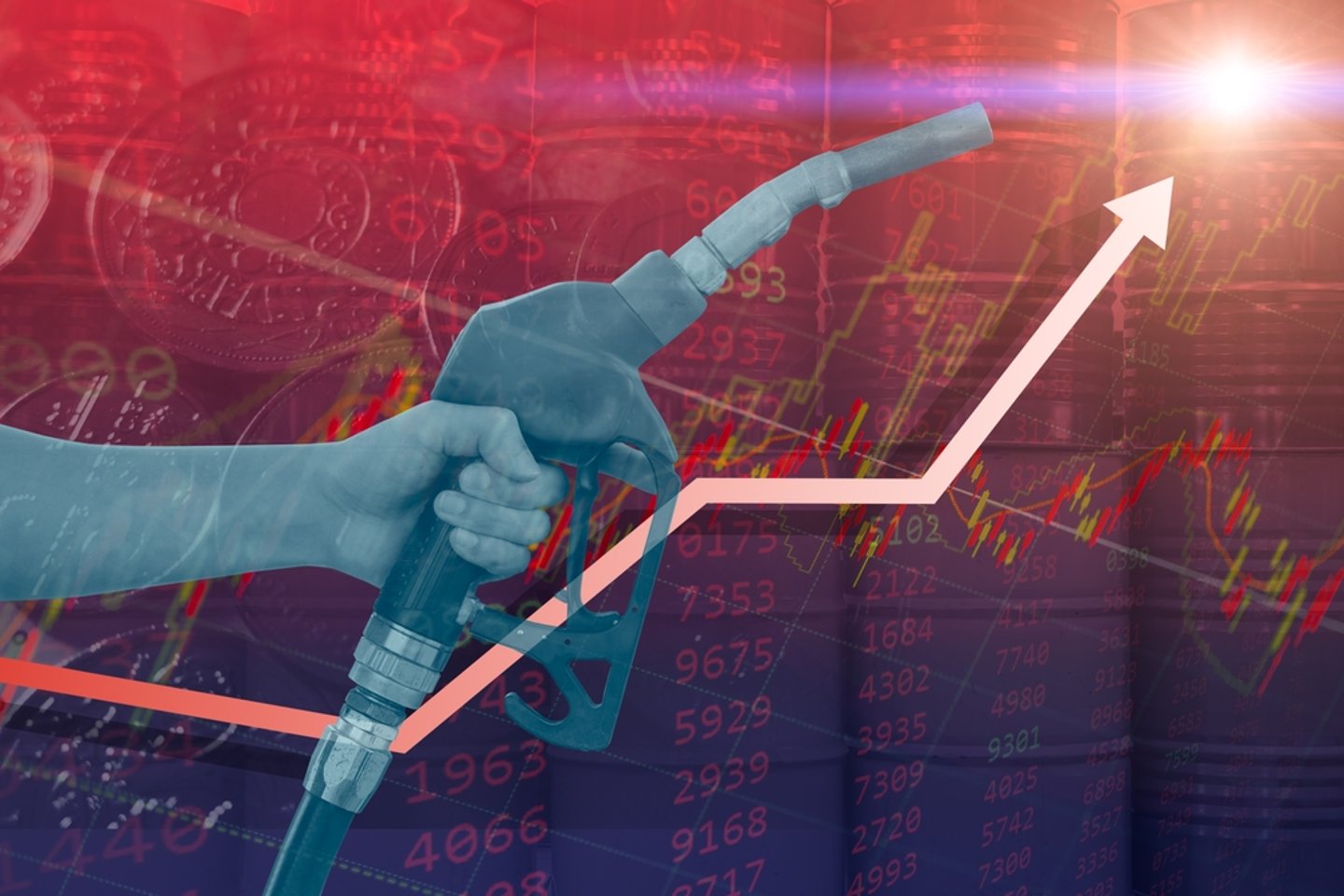 A hand with a gas nozzle in front of a climbing graph indicating the rising cost of graph