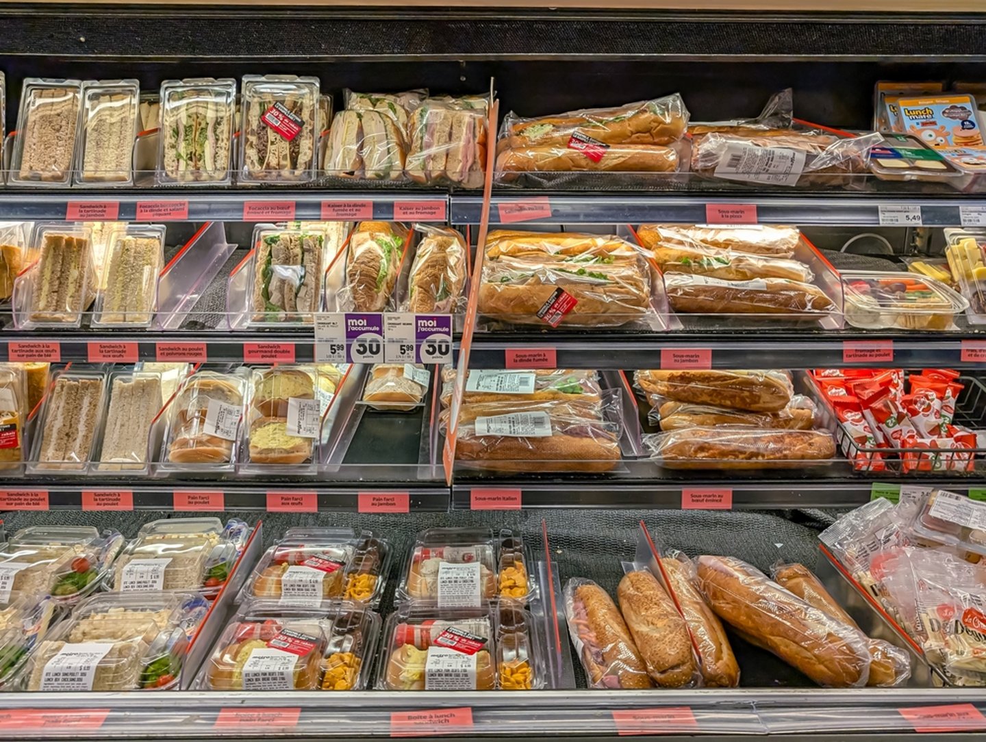 refrigerated shelf of ready to go sandwiches and snacks