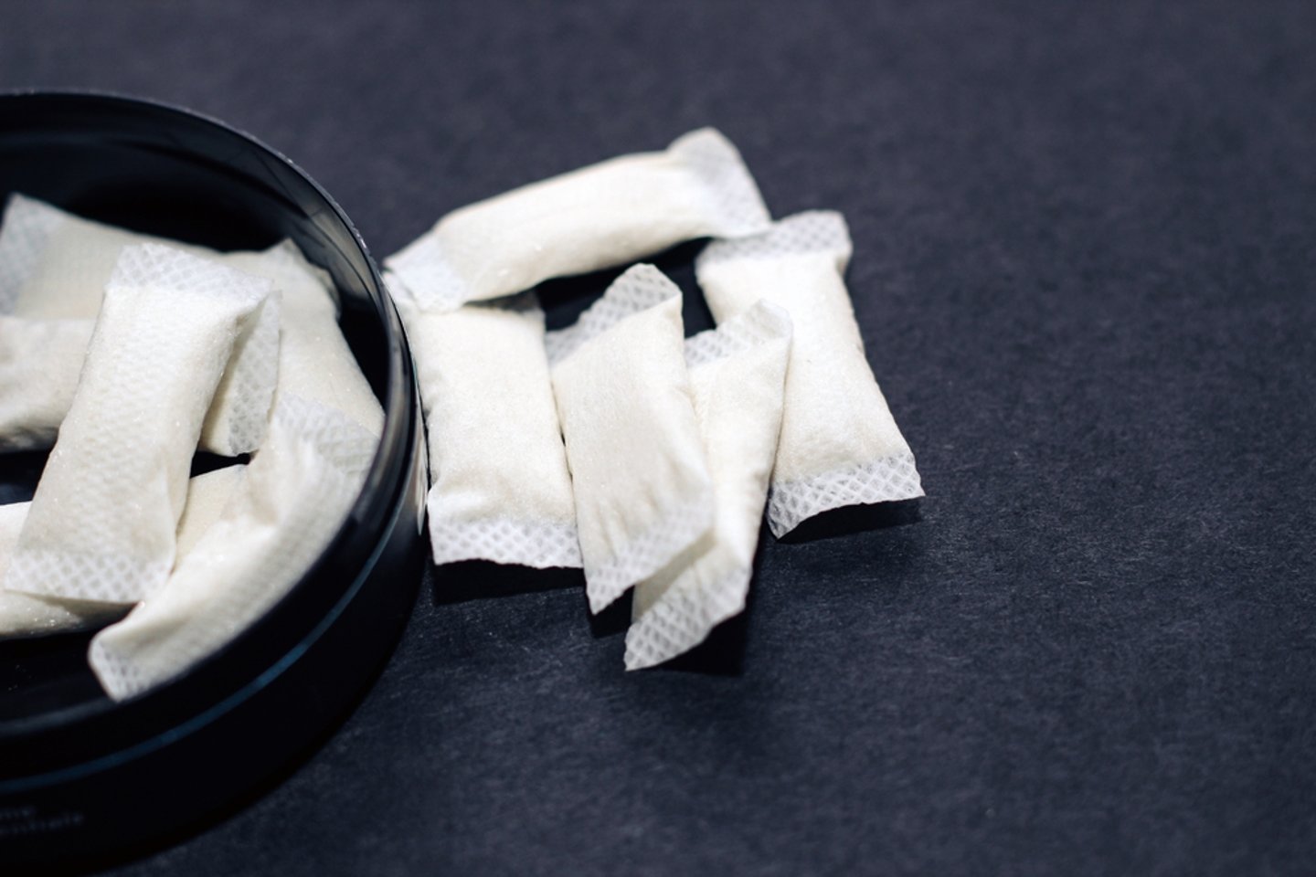 Open tin of nicotine pouches